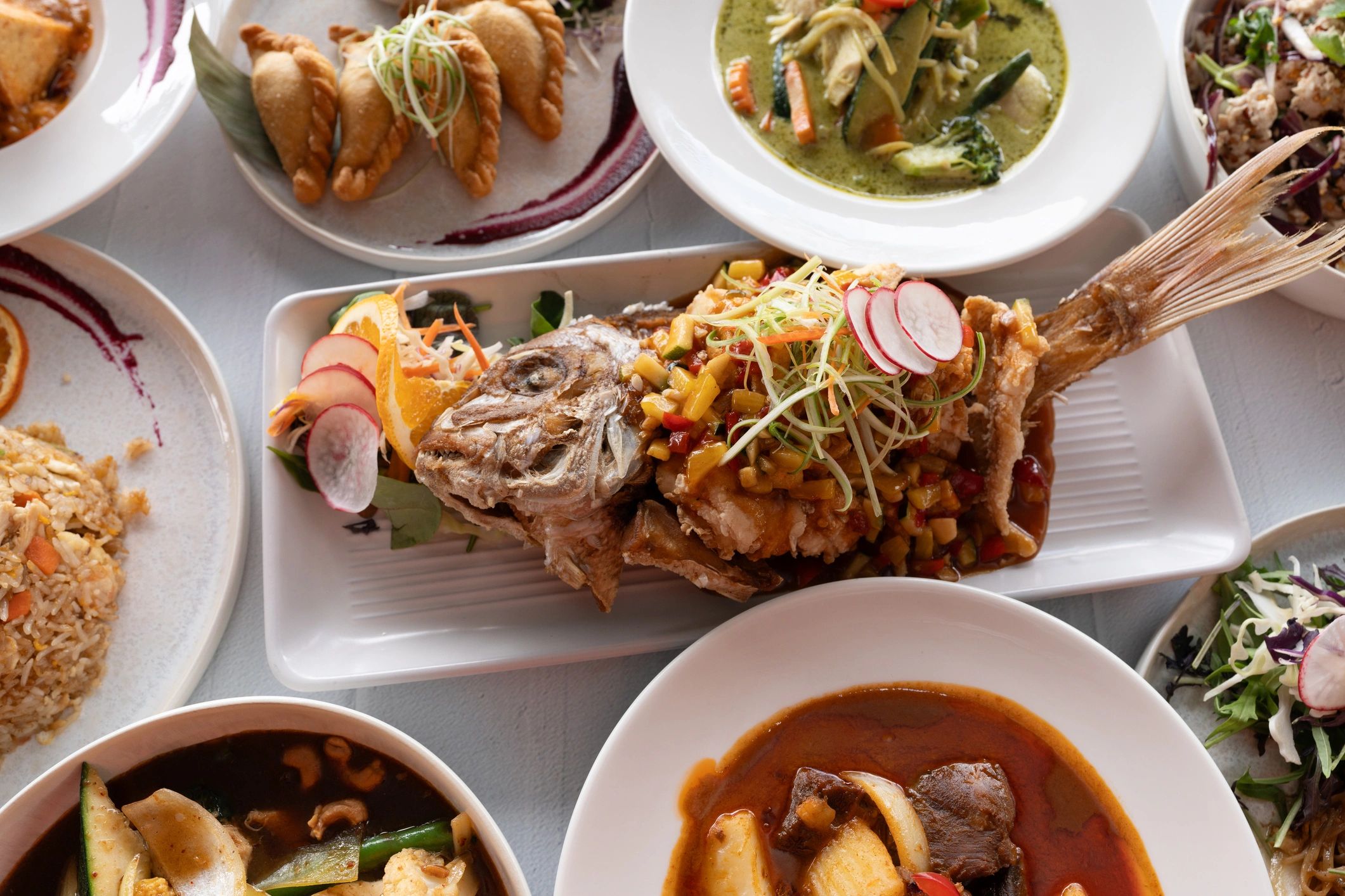 Colorful seafood and international dishes served family-style