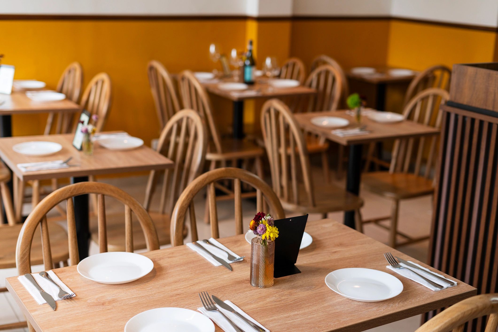 Warm, welcoming restaurant dining room ready for guests