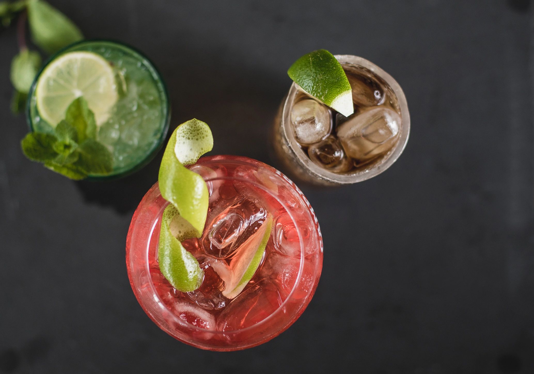 Set of colorful cocktails with fresh lime